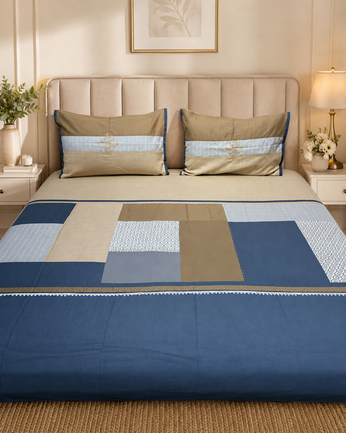 Navy blue patchwork bedsheet set with taupe, beige and light blue panels and matching pillow covers