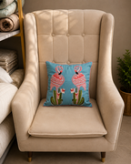 Blue cushion cover with two pink embroidered flamingos on a beige chair